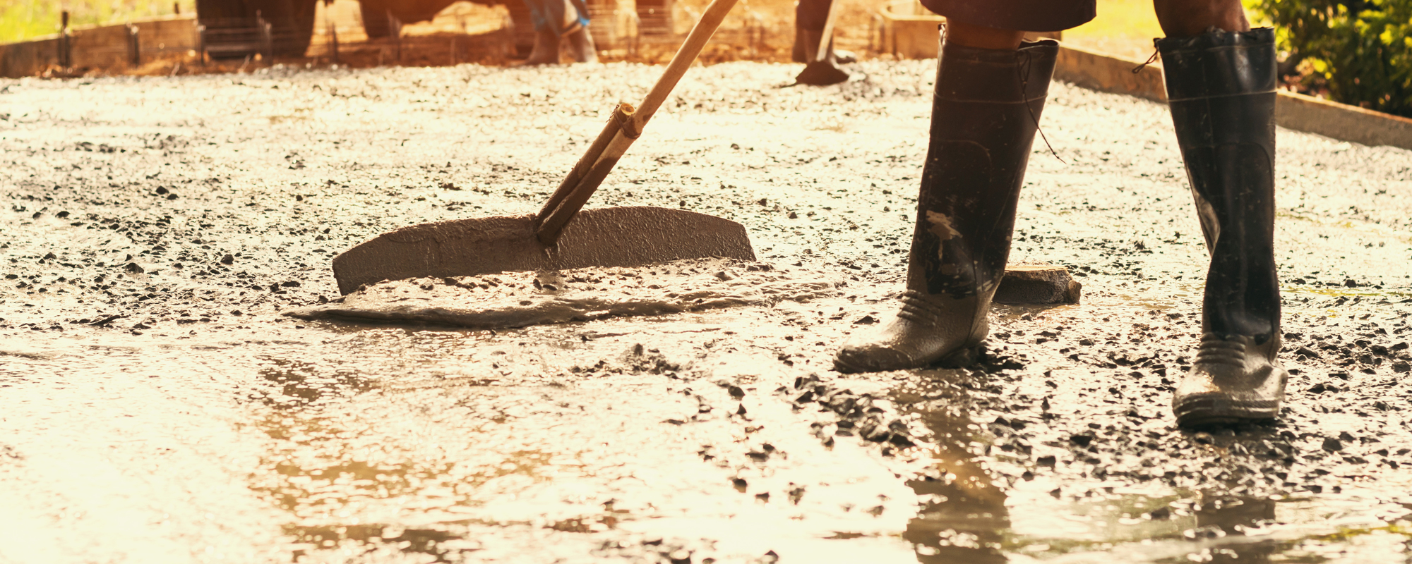 Worker Mix Cement For Building Road At Construction Site